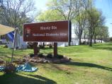 Park sign with tents