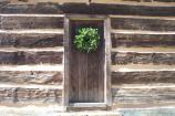 Back door of historic cabin decorated