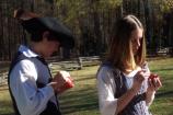 Teen reenactors making pomanders