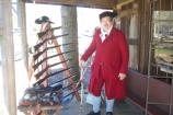 Living history interpreter presents gun display