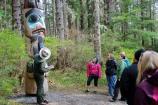 Ranger discussing a totem pole in the park