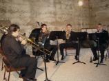 Brass Ensemble performing in barn.