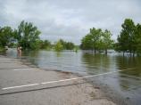 High water covers most of the Point Boat Ramp parking area.