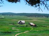 View looking south down Florissant valley with the Hornbek Homestead in the foreground
