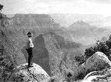 Uniformed Park Ranger, Tex Worley, looks into the Grand Canyon from Arapahoe Point, West of Cape Royal on the North Rim. 05754