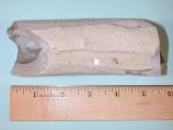 This large fulgurite sample shows how the exterior of a fulgurite column. Note that the broken ends indicate this was a section of a larger piece. Fulgurite may extend deep into the ground and form branches just as a lightning bolt may.