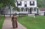 Historic character outside the Boston Store Visitor Center