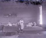 R Chamberlain, teacher in 1910 school room