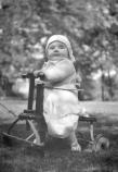 Margaret Truman being pulled on toy in the yard of the Truman Home, 1924-25. Harry S. Truman Library, # 82-352-1.