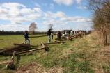 An event sponsored by Unilever, National Parks Tour America. Volunteers and park staff gathered to build fences at Pea Ridge National Military Park.
