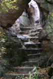 Steps ascend to the top of the quartzite cliff