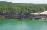 Aerial view of Spray Falls dropping into Lake Superior.