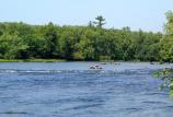 Inner tubes are used to float the stretch of water above Thayers Landing. Bright, sunny, warm summer days bring people to the water.