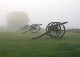 Cannons shrouded on a foggy morning
