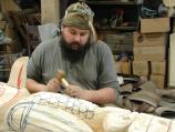 H. Erin Aylor carving new totem in 2006