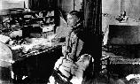 Clara Barton 1902 at her desk