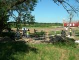 2) Masons work on stabilizing the blacksmith shop
