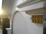 8) Newly repaired dentils in place