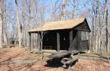 A typical rental unit in cabin camp 3, complete with picnic table, grill and porch.