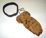 The cylinder phonograph record. The historic tag reads: “Tin Phonograph Cylinder […]l Record”.