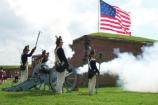 The Fort McHenry Guard fires the cannon.