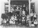 School children pose on steps of Fort Hancock Public school c. 1900. A wooden school building that no longer is standing.