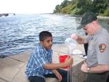 A student at I.S. 27 on Staten Island tests the turbidity of Hudson River water as part of the program 
