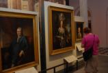 Visitors looking at portraits in Second Bank