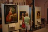 Woman looking at portrait in Second Bank