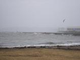 Waves break against Derby Wharf during the March 13-15 storm. Wave action during both the February and March storms caused damage to the east side of Derby Wharf