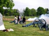 Continental Soldiers demonstrating the firing procedures of a revolutionary war cannon.