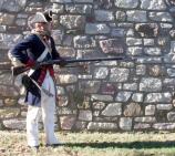 Charge Bayonet! Bring the butt of the firelock under the right arm, letting the piece fall strongly on the palm of the left hand, muzzle pointing directly to the front with the butt of the weapon pressed wth the arm against the side