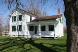 The house was nearly twice the size as it is now, with a mirror image of the front porch and small wing on the other side of the two-story section.