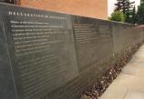 The Declaration of Sentiments and the signers names are written on a blue stone wall, which in summer months, has a calm flow of water flowing over the text.