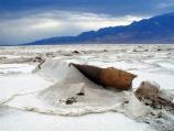 As salt crystals grow over time, slabs of the salt crust are uplifted and eroded.