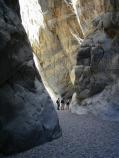 Hikers wanting to explore the narrows of Fall Canyon must climb around the dry-fall.