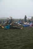 Volunteers for the California Coastal Cleanup, joining the free yoga on the beach.