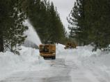 Tom Hull and Tim Miranda move snow off the Main Park Road 1/8 West of the Devastated Area