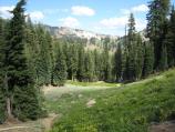 The trail is steep, with rewards of views and meadows.
