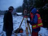 Geologists set up survey equipment at Longmire to measure the effects of November's flood.