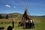 Assembling the tipi poles.