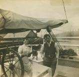 Captain Ole Monsen, wife Martha, and their dog Topsy at the helm of a lumber schooner.SFMNHP K09.6.734p