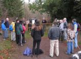 Park staff and volunteers receive a safety briefing before starting work on a new puncheon (walkway) that will corss a forest wetland.