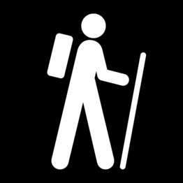 A black and white symbol for a trailhead with a figure of a person, wearing a backpack and carrying a walking stick.