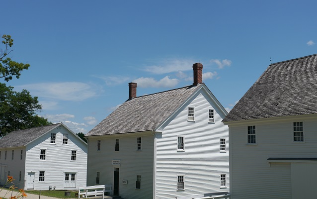 white shaker buildings in a row