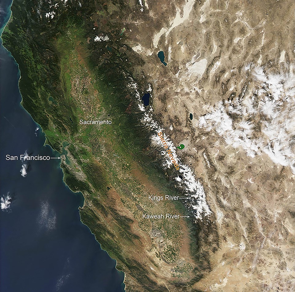 Aerial image shows view of an average year of snowpack (2010) in the Sierra Nevada, with snow covering middle to upper elevations across the Sierra Nevada.