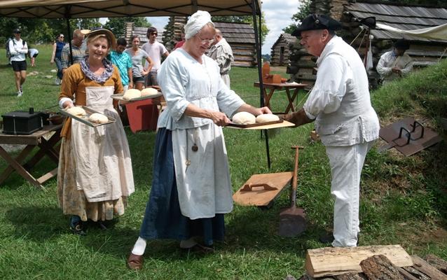 Volunteers and Friends of Valley Forge Park members demonstrate 18th century bread baking and cooking