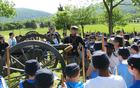 living historian talks about the artillery with students