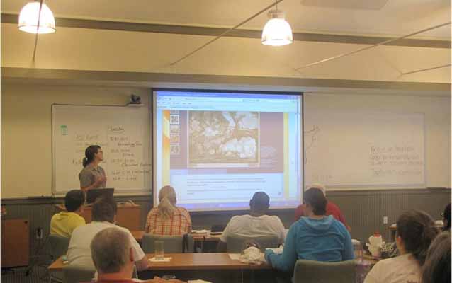 Teacher-Ranger-Teacher Ruth Goodlaxson makes a presentation of educational resources to teachers gathered at the symposium.