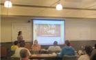 Teacher-Ranger-Teacher Ruth Goodlaxson makes a presentation of educational resources to teachers gathered at the symposium. 